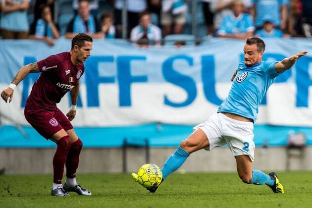 180801 Ciprian Deac of Cluj and Eric Larsson of Malmö FF during the UEFA Champions League qualifying match between Malmö FF and Cluj on August 1, 2018 in Malmö. Photo: Mathilda Ahlberg BILDBYRN Cop 178 Copyright: MATHILDAxAHLBERG BB180801MA082