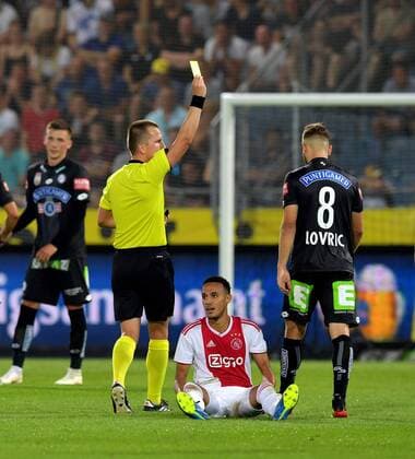 SOCCER - UEFA CL quali, Sturm vs Ajax GRAZ,AUSTRIA,01.AUG.18 - SOCCER - UEFA Champions League qualification, SK Sturm Graz vs AFC Ajax Amsterdam. Image shows referee Bartosz Frankowski (POL), Noussair Mazraoui (Ajax) and Sandi Lovric (Sturm). GEPAxpictures xMichaelxRiedler