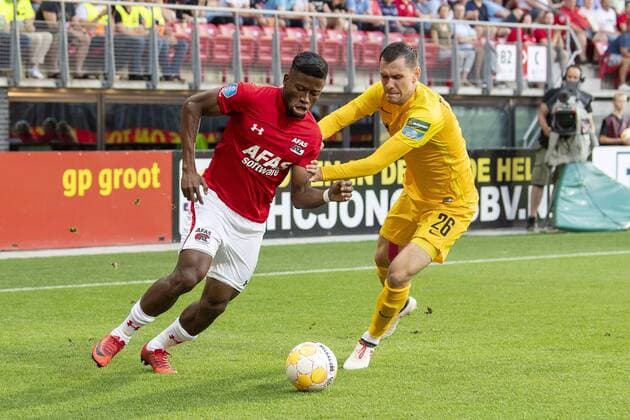 ALKMAAR , 02-08-2018 , AFAS Stadion ,season 2018 2019, Football, 2nd round Europa League qualification . AZ player Fred Friday and FC Kairat player Sergei Politevich during the match AZ - FC Kairat AZ - FC Kairat  x2373175x
