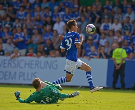 SOCCER, Schalke vs Angers, test match MITTERSILL,AUSTRIA,43317 - SOCCER - 1. DFL, 1. Deutsche Bundesliga, Ligue 1, FC Schalke 04 vs Angers SCO, friendly match. Image shows Ludovic Butelle (Angers) and Benjamin Goller (Schalke). GEPAxpictures xHansxOsterauer