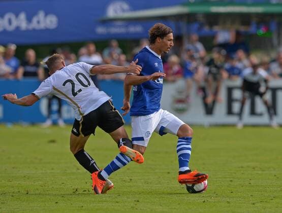 SOCCER, Schalke vs Angers, test match MITTERSILL,AUSTRIA,43317 - SOCCER - 1. DFL, 1. Deutsche Bundesliga, Ligue 1, FC Schalke 04 vs Angers SCO, friendly match. Image shows Flavien Tait (Angers) and Benjamin Stambouli (Schalke). GEPAxpictures xHansxOsterauer