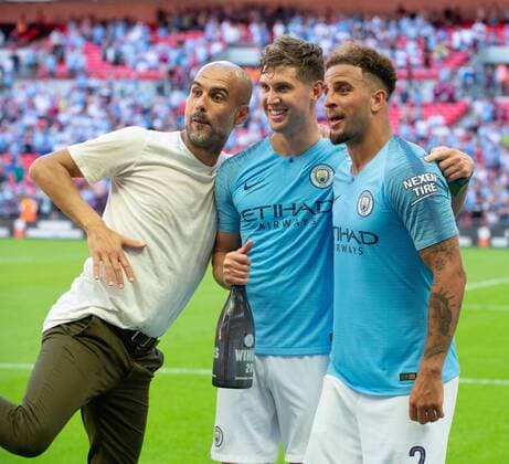 Sport Bilder des Tages (180806) -- LONDON, Aug. 6 2018 -- Manchester City Manager Pep Guardiola (L) and John Stones (C) and Kyle Walker (R) of Manchester City pose for cameras after the Community Shield match between Chelsea and Manchester City at the Wembley Stadium in London, Britain on Aug. 5, 2018. Manchester City won 2-0. ) FOR EDITORIAL USE ONLY. NOT FOR SALE FOR MARKETING OR ADVERTISING CAMPAIGNS. NO USE WITH UNAUTHORIZED AUDIO, VIDEO, DATA, FIXTURE LISTS, CLUB LEAGUE LOGOS OR LIVE SERVICES. ONLINE IN-MATCH USE LIMITED TO 45 IMAGES, NO VIDEO EMULATION. NO USE IN BETTING, GAMES OR SINGLE CLUB LEAGUE PLAYER PUBLICATIONS. (SP)BRITAIN-LONDON-FOOTBALL-THE FA COMMUNITY SHIELD-CHELSEA VS MANCHESTER CITY MarekxDorcik 