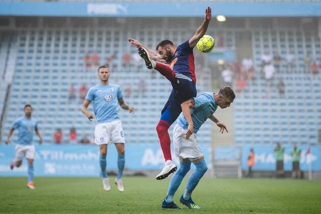 180807 Attila Fiola of Vidi and Sören Rieks of Malmö FF competes for the ball during the UEFA Champions League qualifying match between Malmö FF and Vidi on August 7, 2018 in Malmö. Photo: Mathilda Ahlberg BILDBYRAN Cop 178 Copyright: MATHILDAxAHLBERG BB180807MA008