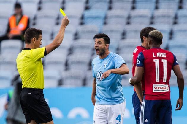 180807 Behrang Safari of Malmö FF gets a yellow card during the UEFA Champions League qualifying match between Malmö FF and Vidi on August 7, 2018 in Malmö. Photo: Mathilda Ahlberg BILDBYRAN Cop 178 Copyright: MATHILDAxAHLBERG BB180807MA012