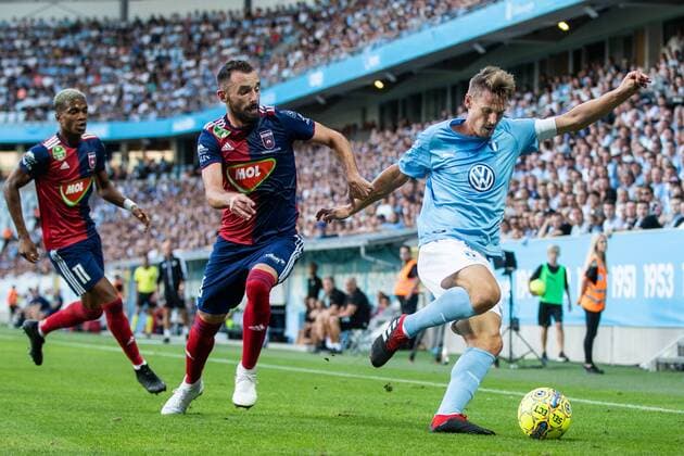 180807 Attila Fiola of Vidi and Markus Rosenberg of Malmö FF competes for the ball during the UEFA Champions League qualifying match between Malmö FF and Vidi on August 7, 2018 in Malmö. Photo: Mathilda Ahlberg BILDBYRAN Cop 178 Copyright: MATHILDAxAHLBERG BB180807MA044
