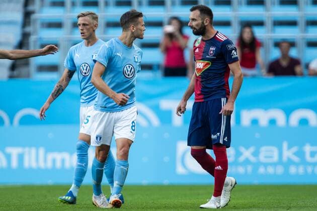 180807 Arnor Ingvi Traustason of Malmö FF in a discussion with Attila Fiola of Vidi during the UEFA Champions League qualifying match between Malmö FF and Vidi on August 7, 2018 in Malmö. Photo: Mathilda Ahlberg BILDBYRAN Cop 178 Copyright: MATHILDAxAHLBERG BB180807MA046