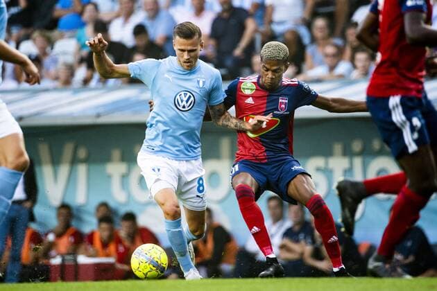 180807 Arn?r Ingvi Traustason of Malmö FF and Lo c Nego of Vidi during the UEFA Champions League qualifying match between Malmö FF and Vidi on August 7, 2018 in Malmö. Photo: Ludvig Thunman BILDBYRN kod LT 35513 Copyright: LUDVIGxTHUNMAN BB180807LT055