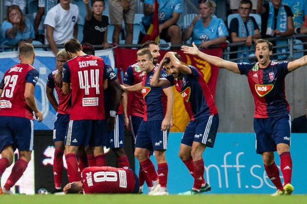 180807 LoÃ¯c Nego of Vidi celebrate with team mates after scoring 1-1 and Anel HadÅ¾ic lies down after being hit by a bottle during the UEFA Champions League qualifying match between Malmö FF and Vidi on August 7, 2018 in Malmö. Photo: Mathilda Ahlberg BILDBYRAN Cop 178 Copyright: MATHILDAxAHLBERG BB180807MA088