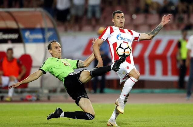 (180808) -- BELGRADE, Aug. 8, 2018 -- Spartak s Martin Toth (L) vies with Crvena Zvezda s Nemanja Radonjic during the UEFA Champions League third qualifying round football match between Crvena Zvezda and Spartak Trnava in Belgrade, Serbia on Aug. 7. 2018. The match ended with 1-1. ) (SP)SERBIA-BELGRADE-FOOTBALL-UEFA-CHAMPIONS LEAGUE-QUALIFICATIONS PredragxMilosavljevic 