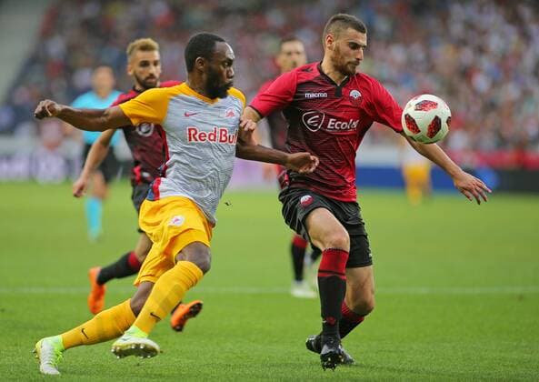 SOCCER - UEFA CL quali, RBS vs Shkendija SALZBURG,AUSTRIA,08.AUG.18 - SOCCER - UEFA Champions League, qualification, Red Bull Salzburg vs KF Shkendija. Image shows Reinhold Yabo (RBS) and Mevlan Adili (Shkendija). GEPAxpictures xThomasxBachun