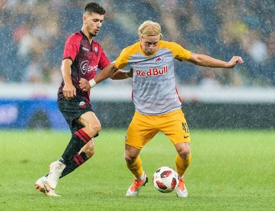08.08.2018, Red Bull Arena, Salzburg, AUT, UEFA CL, FC Salzburg vs KF Shkendija Tetovo, Qualifikation, 3. Runde, Hinspiel, im Bild v.l. Ennur Totre (KF Shkendija Tetovo), Xaver Schlager (FC Salzburg) during the UEFA Championsleague Qualifier 3rd round, 1st leg match between FC Salzburg and KF Shkendija Tetovo at the Red Bull Arena in Salzburg, Austria on 2018 08 08. Salzburg