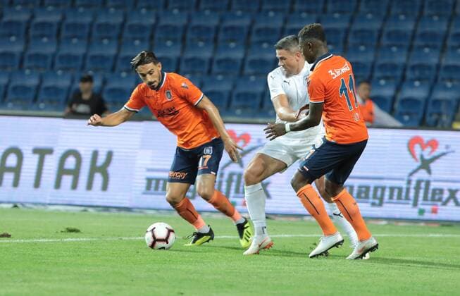 Irfan Can Kahveci (L) , Eljero Elia (R) of Basaksehir and Jonathan Walters 19 of Burnley during the UEFA Europa League Qualifying match between Basaksehir and Burnley at Basaksehir Fatih Terim Stadium in Istanbul , Turkey on August 09, 2018. 