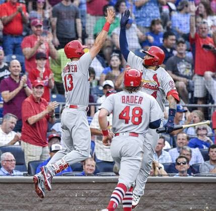 August 10, 2018 - Kansas City, MO, USA - The St. Louis Cardinals Matt Carpenter (13) is congratulated by Yadier Molina (4) after Carpenter hit a two-run home run in the second inning that also scored Harrison Bader (48) against the Kansas City Royals on Friday, Aug. 10, 2018, at Kauffman Stadium in Kansas City, Mo. St. Louis at Kansas City - ZUMAm67_ 20180810_zaf_m67_021 Copyright: xJohnxSleezerx