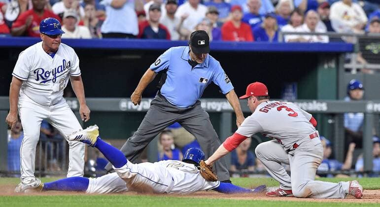 August 10, 2018 - Kansas City, MO, USA - The Kansas City Royals Adalberto Mondesi dives safely back to third before the tag from St. Louis Cardinals third baseman Jedd Gyorko on a fly ball out by Whit Merrifield in the third inning on Friday, Aug. 10, 2018, at Kauffman Stadium in Kansas City, Mo. St. Louis at Kansas City - ZUMAm67_ 20180810_zaf_m67_024 Copyright: xJohnxSleezerx