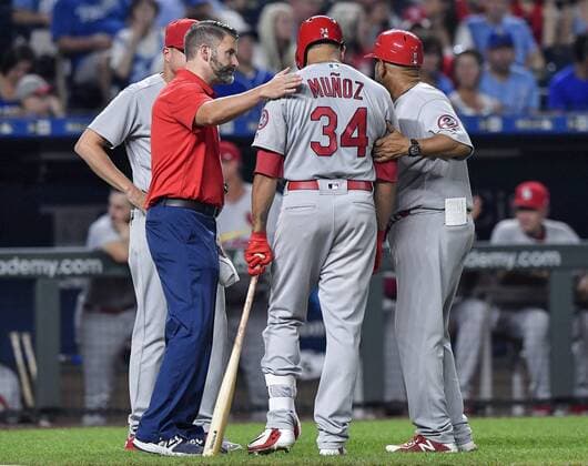 August 10, 2018 - Kansas City, MO, USA - The St. Louis Cardinals Yairo Munoz is checked on before exiting the game in the sixth inning against the Kansas City Royals on Friday, Aug. 10, 2018, at Kauffman Stadium in Kansas City, Mo. St. Louis at Kansas City - ZUMAm67_ 20180810_zaf_m67_028 Copyright: xJohnxSleezerx