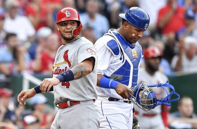 August 11, 2018 - Kansas City, MO, USA - The St. Louis Cardinals Yadier Molina scores in front of Kansas City Royals catcher Salvador Perez on a single by Jose Martinez in the third inning on Saturday, Aug. 11, 2018, at Kauffman Stadium in Kansas City, Mo. St. Louis at Kansas City - ZUMAm67_ 20180811_zaf_m67_012 Copyright: xJohnxSleezerx
