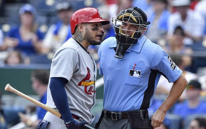 August 12, 2018 - Kansas City, MO, USA - St. Louis Cardinals catcher Yadier Molina exchanges words with home plate umpire Adam Hamari after being called out looking at strike three in the first inning against the Kansas City Royals on Sunday, Aug. 12, 2018 at Kauffman Stadium in Kansas City, Mo. St. Louis Cardinals vs. Kansas City Royals - ZUMAm67_ 20180812_zaf_m67_018 Copyright: xJohnxSleezerx