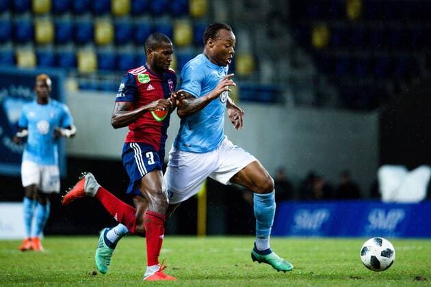 180814 Paulo Vinicius of Vidi Behrang and Carlos Strandberg of Malmö FF during the UEFA Champions League qualifying match between Vidi and Malmö FF on August 14, 2018 in Felcsut. Photo: Ludvig Thunman BILDBYRAN kod LT 35516 Copyright: LUDVIGxTHUNMAN BB180814LT043