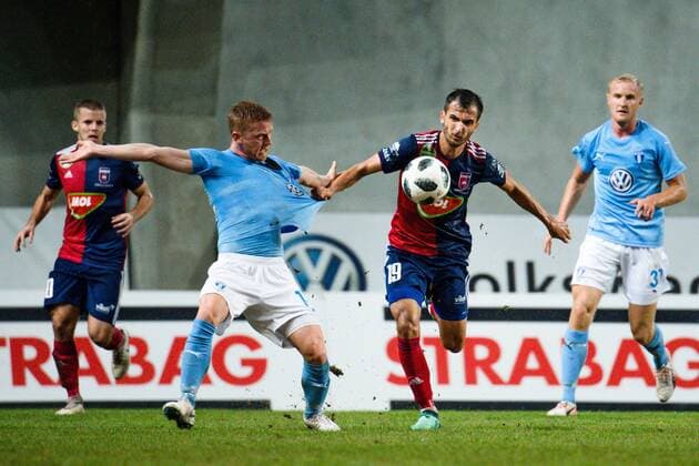 180814 Anders Christiansen of Malmö FF against Boban Nikolov of Vidi during the UEFA Champions League qualifying match between Vidi and Malmö FF on August 14, 2018 in Felcsut. Photo: Ludvig Thunman BILDBYRN kod LT 35516 Copyright: LUDVIGxTHUNMAN BB180814LT048
