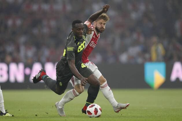 (L-R) Paul-Jose M Poku of Standard Liege, Lasse Schone of Ajax during the UEFA Champions League third round qualifying second leg match between Ajax Amsterdam and Royal Standard de Liege at the Johan Cruijff Arena on August 14, 2018 in Amsterdam, The Netherlands UEFA Champions League 2018 2019 xVIxVIxImagesx xMauricexvanxSteenxIVx 11776848