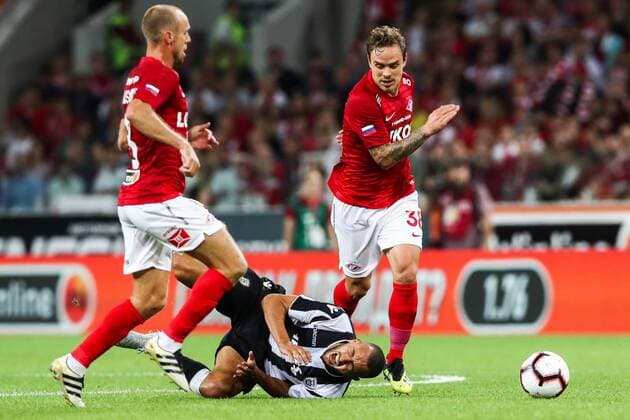 MOSCOW, RUSSIA - AUGUST 14, 2018: PAOK Thessaloniki s Omar El Kaddouri (C), Spartak Moscowâ€™s Denis Glushakov (L) and Andrei Yeshchenko in their 2018-19 UEFA Champions League third qualifying round match at Moscow s Otkritie Arena. Stanislav Krasilnikov TASS  TS08CC3B