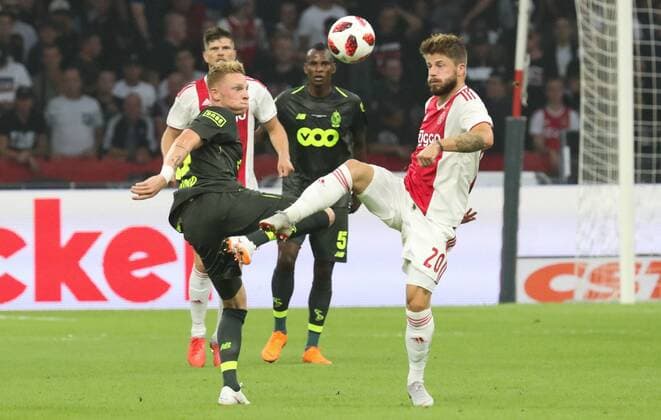 Standard s Renaud Emond and Ajax Lasse Schone fight for the ball during a soccer game between Dutch club AFC Ajax and Belgian team Standard de Liege, Tuesday 14 August 2018 in Amsterdam, the Netherlands, the return leg of the third qualifying round of the UEFA Champions League. The first leg resulted in a 2-2 draw. VIRGINIExLEFOUR  x05405863x