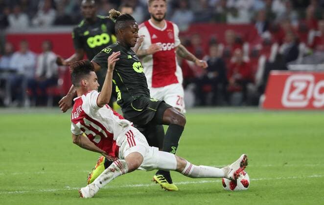Ajax Nicolas Tagliafico and Standard s Samuel Bastien fight for the ball during a soccer game between Dutch club AFC Ajax and Belgian team Standard de Liege, Tuesday 14 August 2018 in Amsterdam, the Netherlands, the return leg of the third qualifying round of the UEFA Champions League. The first leg resulted in a 2-2 draw. VIRGINIExLEFOUR  x05405894x
