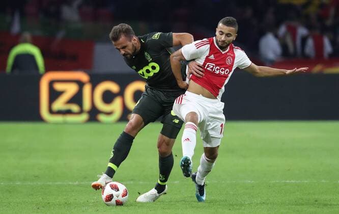 Standard s Orlando Sa and Ajax Zakaria Labyad fight for the ball during a soccer game between Dutch club AFC Ajax and Belgian team Standard de Liege, Tuesday 14 August 2018 in Amsterdam, the Netherlands, the return leg of the third qualifying round of the UEFA Champions League. The first leg resulted in a 2-2 draw. VIRGINIExLEFOUR  x05405930x
