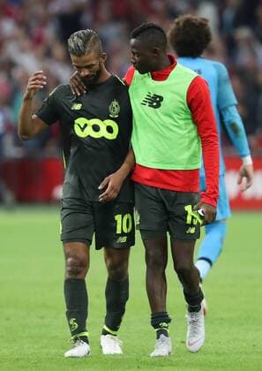 Standard s Mehdi Carcela and Standard s Moussa Djenepo look dejected after a soccer game between Dutch club AFC Ajax and Belgian team Standard de Liege, Tuesday 14 August 2018 in Amsterdam, the Netherlands, the return leg of the third qualifying round of the UEFA Champions League. The first leg resulted in a 2-2 draw. VIRGINIExLEFOUR  x05405931x