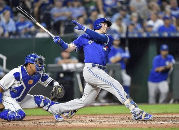 August 14, 2018 - Kansas City, MO, USA - The Toronto Blue Jays Justin Smoak connects on a double in front of Kansas City Royals catcher Salvador Perez in the third inning on Tuesday, Aug. 14, 2018, at Kauffman Stadium in Kansas City, Mo. Toronto at Kansas City - ZUMAm67_ 20180814_zaf_m67_030 Copyright: xJohnxSleezerx