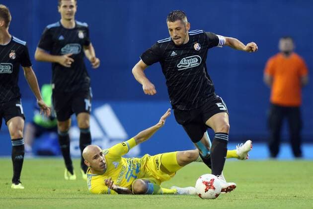 (180815) -- ZAGREB, Aug. 15, 2018 -- Arijan Ademi (front R) of GNK Dinamo Zagreb vies with Richard Almeida of FC Astana during the second leg of the 3rd round UEFA Champions League qualifying match in Zagreb, Croatia, on Aug. 14, 2018. GNK Dinamo Zagreb won 1-0. ) (SP)CROATIA-ZAGREB-SOCCER-UEFA CHAMPIONSHIP LEAGUE-QUALIFYING MATCH LukaxStanzl 