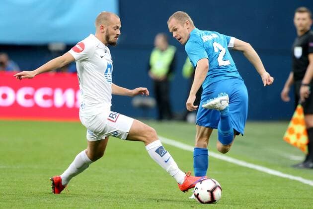 ST PETERSBURG, RUSSIA â€“ AUGUST 23, 2018: FC Molde s Eirik Hestad (L) and FC Zenit St Petersburg s Alexander Anyukov in action in Leg 1 of their 2018â€“19 UEFA Europa League play-off round football match at Saint Petersburg Stadium. Peter Kovalev TASS  TS08DB8A