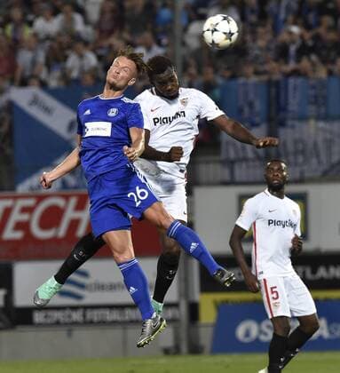 L-R Martin Nesport (Olomouc), Joris Gnagnon and Ibrahim (both Sevilla) Amadou in action during the European League qualification match SK Sigma Olomouc vs Sevilla in Olomouc, Czech Republic, August 23, 2018. (CTKxPhoto LudekxPerina) CTKPhotoP201808230962701  LPE 013