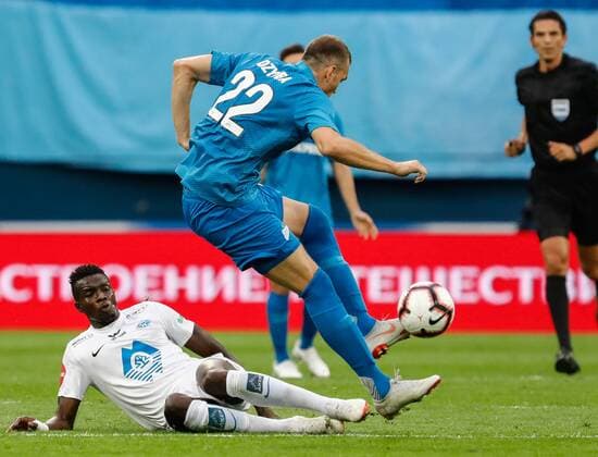 August 23, 2018 - Saint Petersburg, Russia - Artem Dzyuba (R) of FC Zenit Saint Petersburg and Babacar Sarr of Molde FK vie for the ball during the UEFA Europa League play-offs first leg match between FC Zenit Saint Petersburg and Molde FK on August 23, 2018 at Saint Petersburg Stadium in Saint Petersburg, Russia. Zenit Saint Petersburg v Molde FK - UEFA Europa League: Play-offs  - ZUMAn230 20180823_zaa_n230_140 Copyright: xMikexKireevx