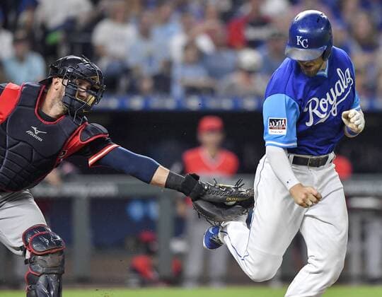August 24, 2018 - Kansas City, MO, USA - The Kansas City Royals Hunter Dozier is tagged out by Cleveland Indians catcher Yan Gomes, left, on a dropped third strike to end the fourth inning on Friday, Aug. 24, 2018, at Kauffman Stadium in Kansas City, Mo. Cleveland at Kansas City - ZUMAm67_ 20180824_zaf_m67_067 Copyright: xJohnxSleezerx