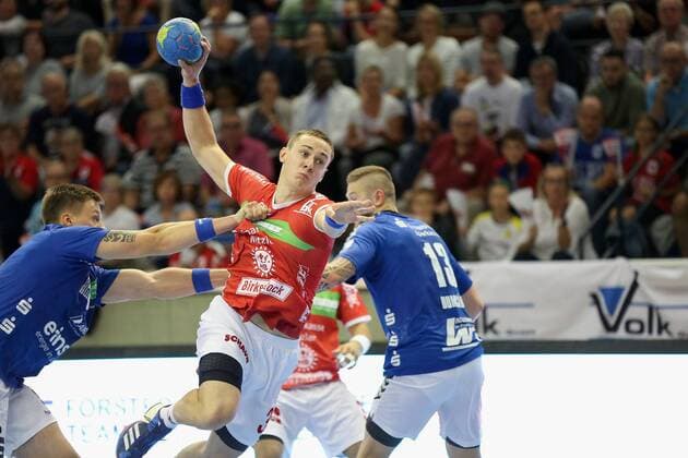 Johannes Klein (TV Huettenberg, 33), Mindaugas Dumcius (EHV Aue, 13) TV Huettenberg - EHV Aue, 2. HBL Giessen