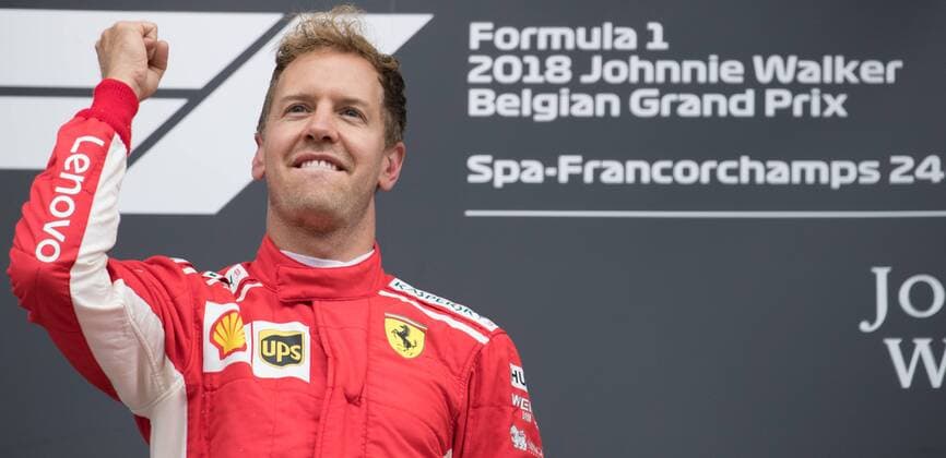 Ferrari s German driver Sebastian Vettel celebrates on the podium after winning the Spa-Francorchamps Formula One Grand Prix of Belgium race, in Spa-Francorchamps, Sunday 26 August 2018. BENOITxDOPPAGNE  x05414414x