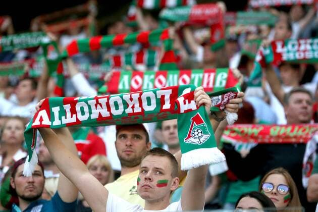 MOSCOW, RUSSIA - AUGUST 26, 2018: Lokomotiv Moscow supporters hold up fan scarves during a 2018 2019 Russian Football Premier League Round 5 match between Lokomotiv Moscow and Anzhi Makhachkala at RZhD Area (Lokomotiv Arena). Sergei Fadeichev TASS  TS08E1F1