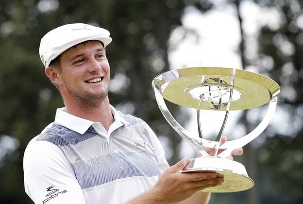 Bryson DeChambeau holds the championship trophy after the final round of The Northern Trust golf championship Fed Ex Cup playoffs at Ridgewood Country Club in Paramus, New Jersey on August 26, 2018. DeChambeau wins the tournament with a score of 18 under par.  NJP20180826131 JOHNxANGELILLO