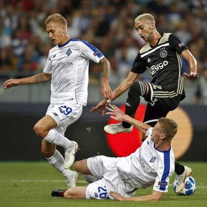 KIEV, Ukraine, 28-08-2018, Stadium NSK Olimpiejsky, football, season 2018 2019, Champions League Play-offs , Dynamo Kiev player Vitaliy Buyalskiy (L) and Dynamo Kiev player Mykyta Burda (C) and Ajax player Hakim Ziyech (R) during the game Dynamo Kiev - Ajax. Dynamo Kiev - Ajax  x2430536x