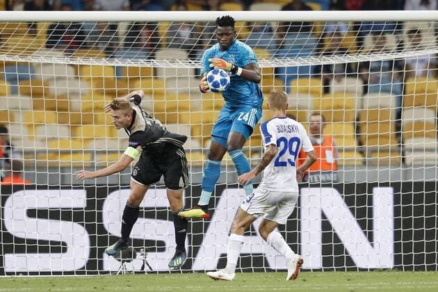 KIEV, Ukraine, 28-08-2018, Stadium NSK Olimpiejsky, football, season 2018 2019, Champions League Play-offs , Ajax goalkeeper Andre Onana (C) and Ajax player Matthijs de Ligt (L) and Dynamo Kiev player Vitaliy Buyalskiy (R) during the game Dynamo Kiev - Ajax (0-0) . Dynamo Kiev - Ajax  x2431742x