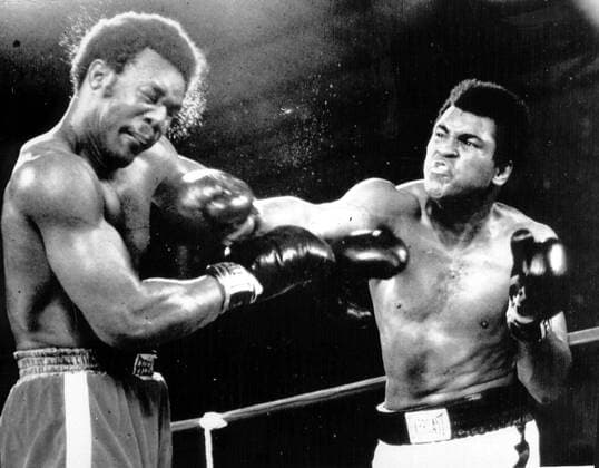 MOHAMMAD (I AM THE GREATEST !) ALI ROCKS GEORGE FOREMAN WITH A HARD RIGHT 29 10 EN ROUTE TO AN ! 8-ROUND KNOCKOUT OF THE HEAVYWEIGHT CHAMP; ALI REGAINED HIS CROWN IN WHAT WAS DESCRIBED AS THE FIGHT OF THE YEAR. . .JEP WST BELGA  x85196488stx
