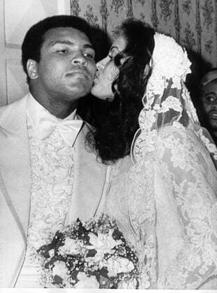 HEAVYWEIGHT CHAMPION MUHAMMAD ALI GETS A KISS ON THE CHEEK FROM HIS BRIDE, VERONICA PORCHE,FOLLOWING THEIR WEDDING AT THE BEVERLY HILSHIRE HOTEL. IT WAS THE THIRD MARRIAGE FOR THE 35-YEAR-OLD BOXING CHAMPION AND THE FIRST FOR THE 22-YEARING OLD BRIDE.. .JVB WST BELGA  x85196603stx