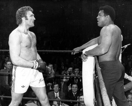 MUHAMMAD ALI, WHO HAD COME TO BRITAIN TO WATCH JOE BUGNER , THE EUROPEAN HEAVYWEIGHT CHAMPION , FIGHT AT THE ROYAL ALBERT HALL TONIGHT , SQUARED UP TO HIMSELF, EVEN TAKING HIS SHORT OFF, TO THE AMUSEMENT OF SPECTATORS. THIS WAS AFTER BUGNER HAD DEFEATED ALBERTO LOVELL; AS USUAL, ALI HAD SOME COMMENTS TO MAKE.  x85190659stx