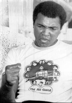HEAVYWEIGHT CHAMPION MUHAMMAD ALI PUNCTUATES HIS REMARKS WITH A CLENCHED FIST 4 15 AS HE CHALLENGES GEORGE FOREMAN,THE FORMER CHAMPION,TO A THREE ROUND EXHIBITION MATCH ON A TELEVISED 4 26 CARD. ALI ALSO PREDICTED HE WOULD KNOCK OUT RON LYLE IN THE EIGHTH ROUND IN HIS NEXT CHAMPOISHIP FIGHT IN LAS VEGAS. NEXT MONTH.. .HPT WST BELGA  x85197431stx