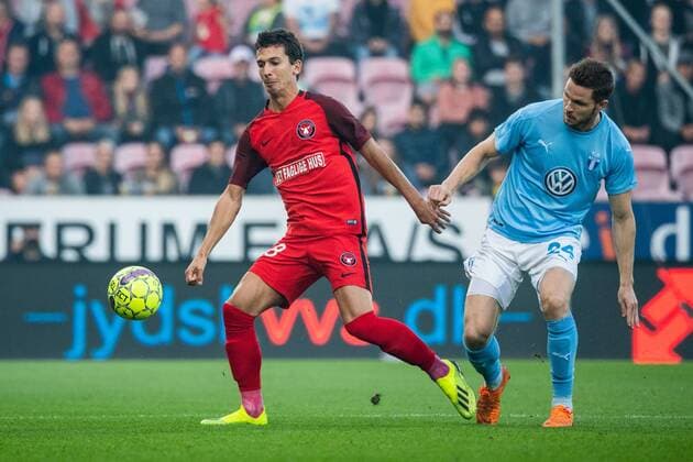 180830 Gustav Wikheim of Midtjylland and Lasse Nielsen of Malmö FF during the Europa League qualifying match between Midtjylland and Malmö FF on August 30, 2018 in Herning. Photo: Ludvig Thunman BILDBYRN kod LT 35529 Copyright: LUDVIGxTHUNMAN BB180830LT028