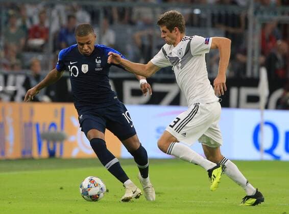 (180907) -- MUNICH, Sept. 7, 2018 France s Kylian Mbappe (L) vies with Germany s Thomas Mueller during the UEFA Nations League football match between Germany and France, in Munich, Gremany, on Sept. 6, 2018. The match ended in a 0-0 draw. ) (SP)GERMANY-MUNICH-SOCCER-UEFA NATIONS LEAGUE-GERMANY VS FRANCE PhilippexRuiz 