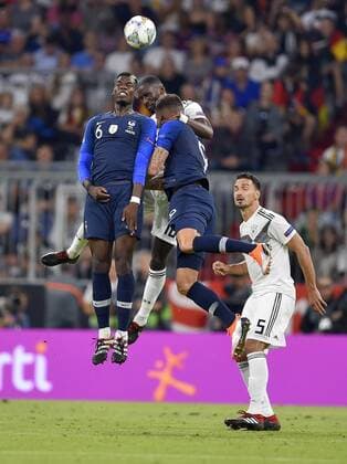 06.09.2018, Fussball, UEFA Nations-League 2018 2019, 1.Spieltag in München in der Allianz-Arena: Deutschland - Frankreich. v.l. Paul Pogba (Frankreich), Antonio Rüdiger (Deutschland) und Olivier Giroud (Frankreich) im Duell um den Ball. DFB and DFL regulations prohibit any use of photographs as image sequences and or quasi-video.