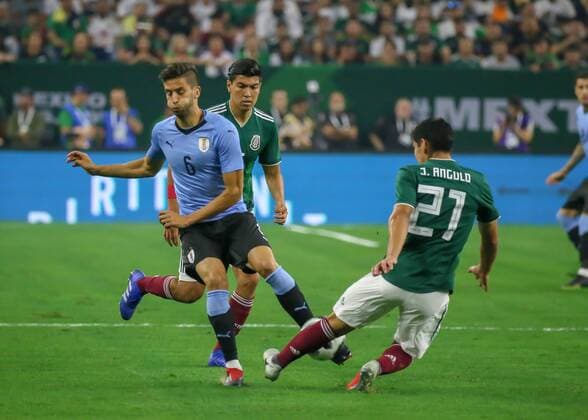 HOUSTON, TX - SEPTEMBER 07: Uruguay midfielder Rodrigo Bentancur (6) and Mexico defender Jesus Angulo (21) fight for ball during the soccer match between Mexico and Uruguay on September 7, 2018 at NRG Stadium in Houston, Texas. (Photo by Leslie Plaza Johnson Icon Sportswire) SOCCER: SEP 07 Mexico v Uruguay Icon180907010 EDITORIAL USE ONLY