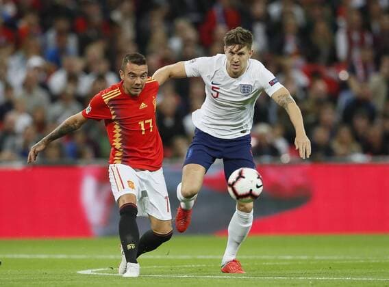Iago Aspas of Spain tackled by John Stones of England during the UEFA Nations League - League A - Group 4 match at Wembley Stadium, London. Picture date 8th September 2018. Picture credit should read: David Klein Sportimage EDITORIAL USE ONLY. No use with unauthorised audio, video, data, fixture lists, club league logos or live services. Online in-match use limited to 120 images, no video emulation. No use in betting, games or single club league player publications.